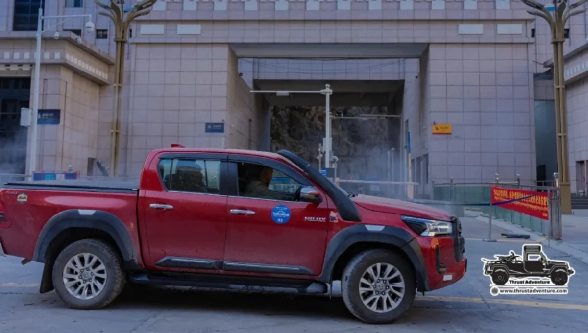 Red Toyota Hilux at the China Border on Road to Lhasa