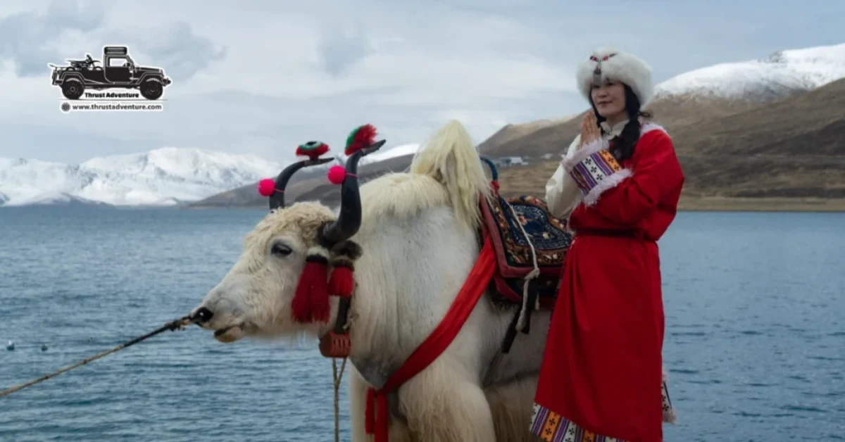 Chinese girl in traditional dress on Yamdrok Lake.